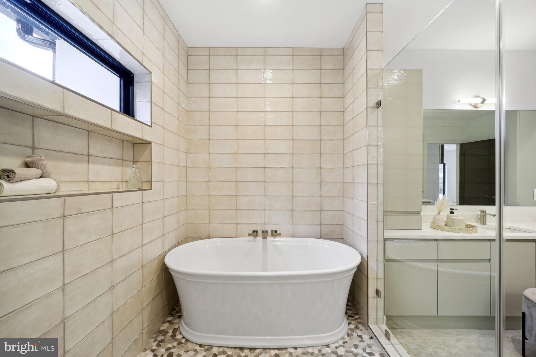 7006 Hector Road McLean, VA 22101 - Photo 35 of 50 Freestanding tub & a glass-enclosed walk-in shower