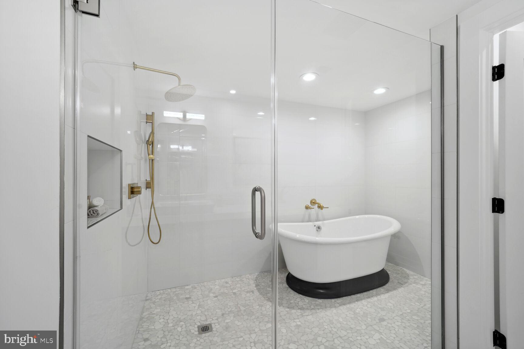 7006 Hector Road McLean, VA 22101 - Photo 47 of 50 Freestanding tub & a glass-enclosed walk-in shower