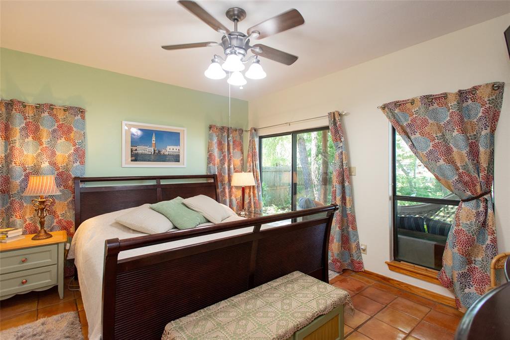 121 Xit Ranch Road Trinidad, TX 75163 - Photo 13 of 40 This inviting room features warm-toned tile flooring and a ceiling fan with integrated lighting