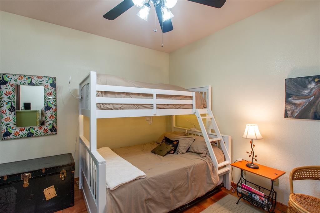 121 Xit Ranch Road Trinidad, TX 75163 - Photo 18 of 40 This room features light-colored walls and a ceiling fan with integrated lighting