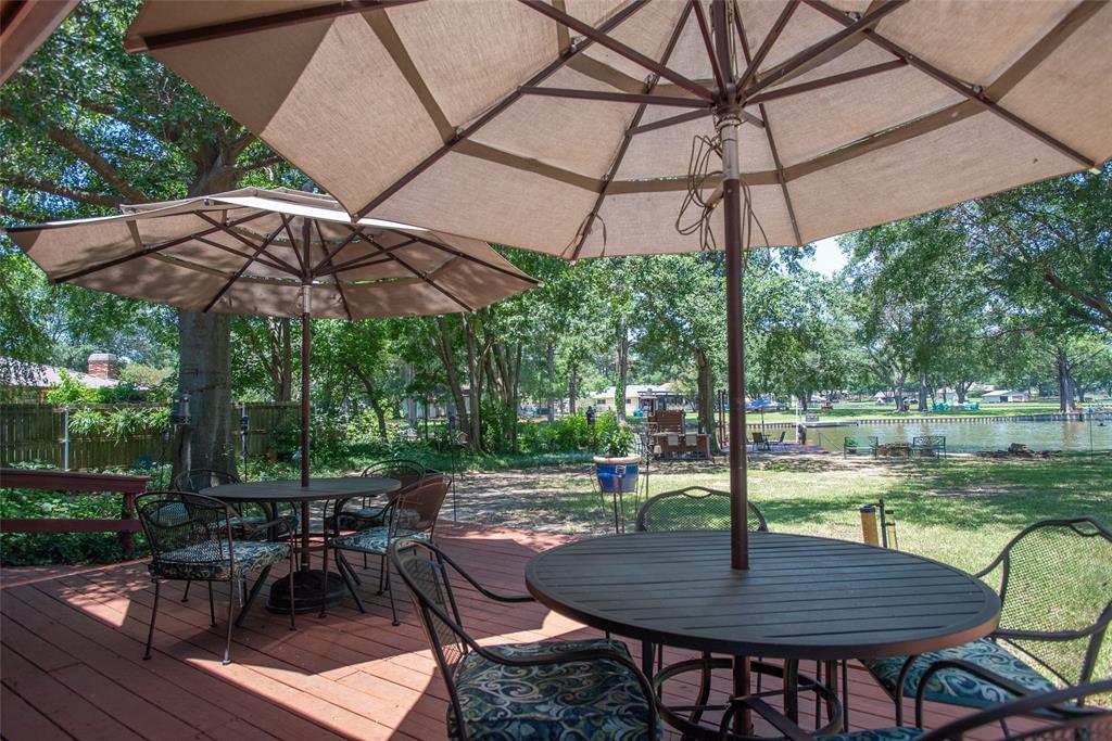 121 Xit Ranch Road Trinidad, TX 75163 - Photo 23 of 40 The property features a spacious deck with a water view