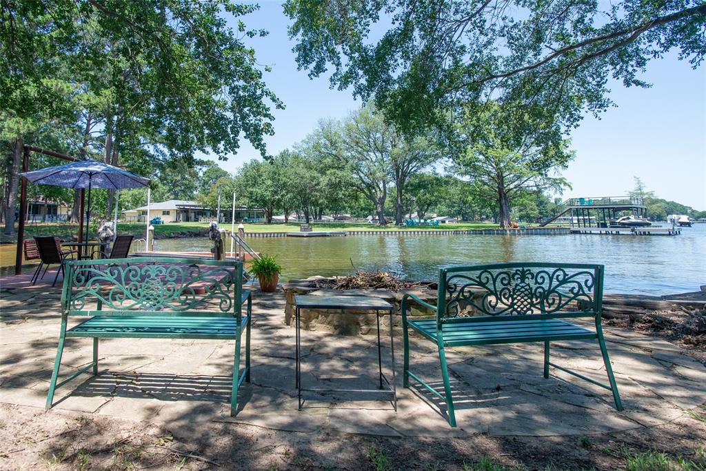 121 Xit Ranch Road Trinidad, TX 75163 - Photo 28 of 40 This property features a waterfront setting with a private dock and a patio area, perfect for enjoying the views of the water
