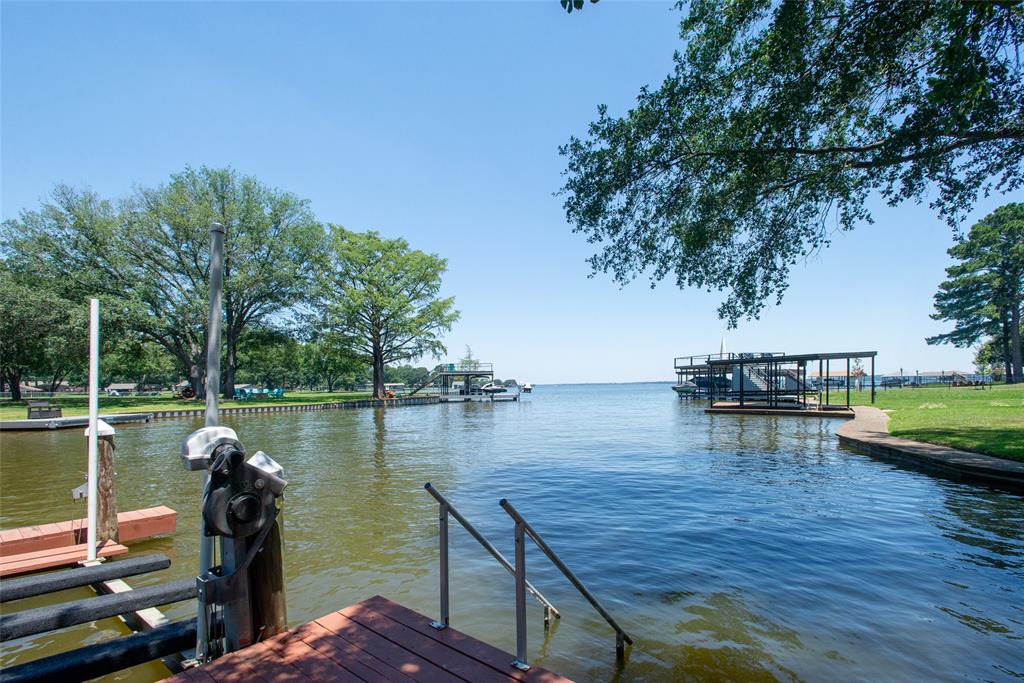 121 Xit Ranch Road Trinidad, TX 75163 - Photo 31 of 40 The property offers a waterfront dock with a boat lift, providing direct access to the lake