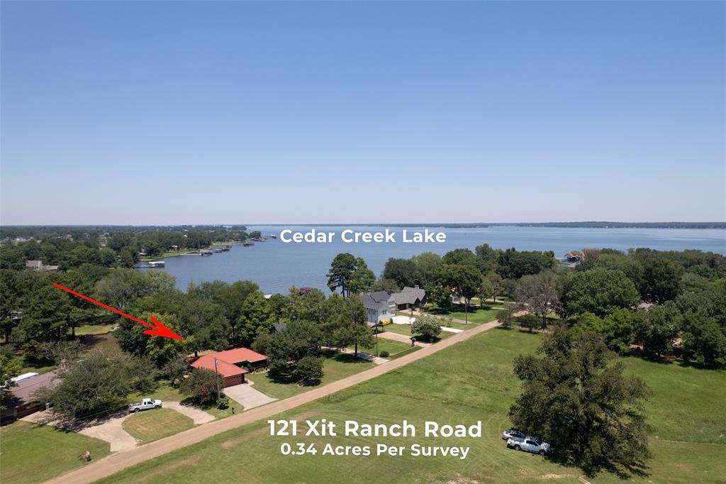 121 Xit Ranch Road Trinidad, TX 75163 - Photo 39 of 40 Aerial view of the property, featuring a red-roofed residence nestled among mature trees