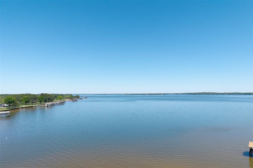 121 Xit Ranch Road Trinidad, TX 75163 - Photo 40 of 40 Expansive water views with a clear sky, featuring a shoreline of Cedar Creek Lake