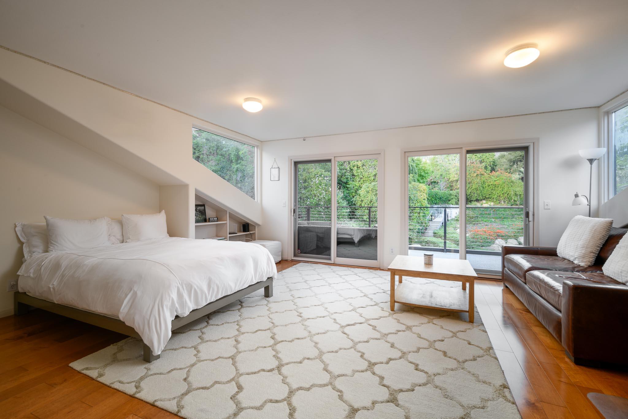 790 Ayala Lane Montecito, CA 93108 - Photo 13 of 24 a bedroom with a bed and glass door