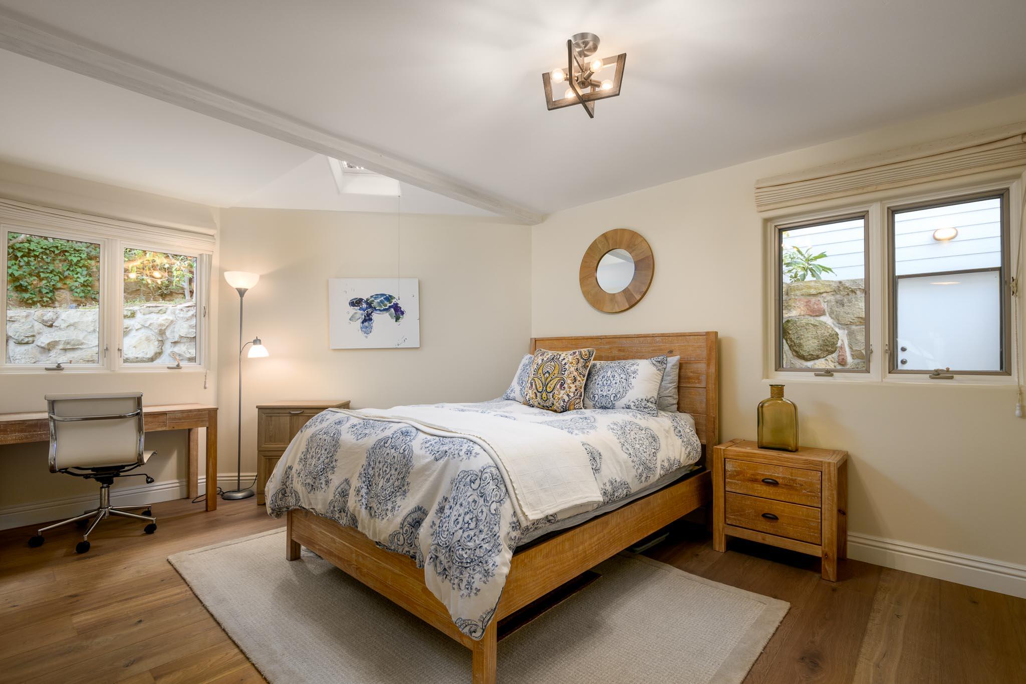 790 Ayala Lane Montecito, CA 93108 - Photo 14 of 24 a bedroom with a bed and a table in it