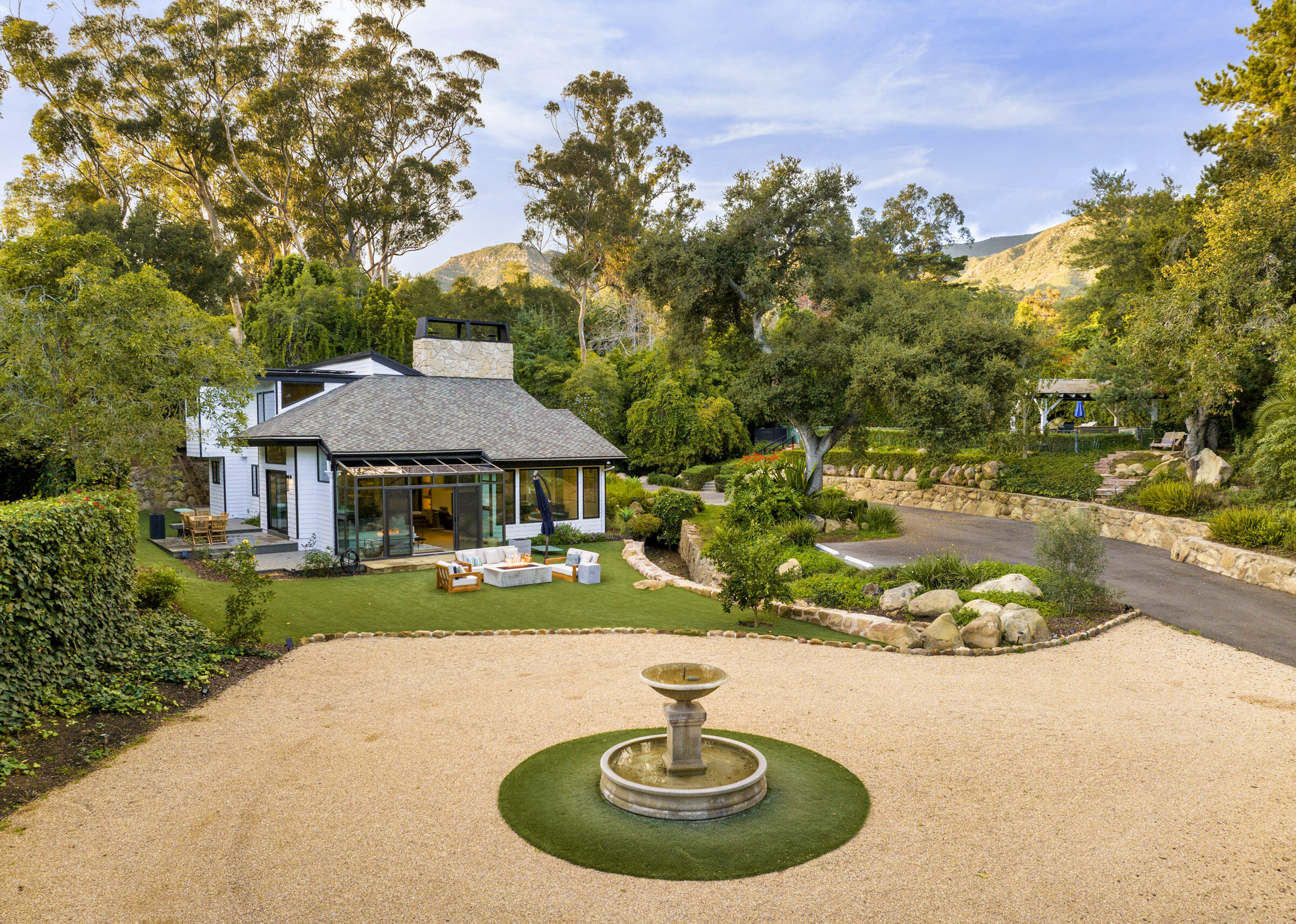 790 Ayala Lane Montecito, CA 93108 - Photo 2 of 24 a backyard of a house with a yard and outdoor seating