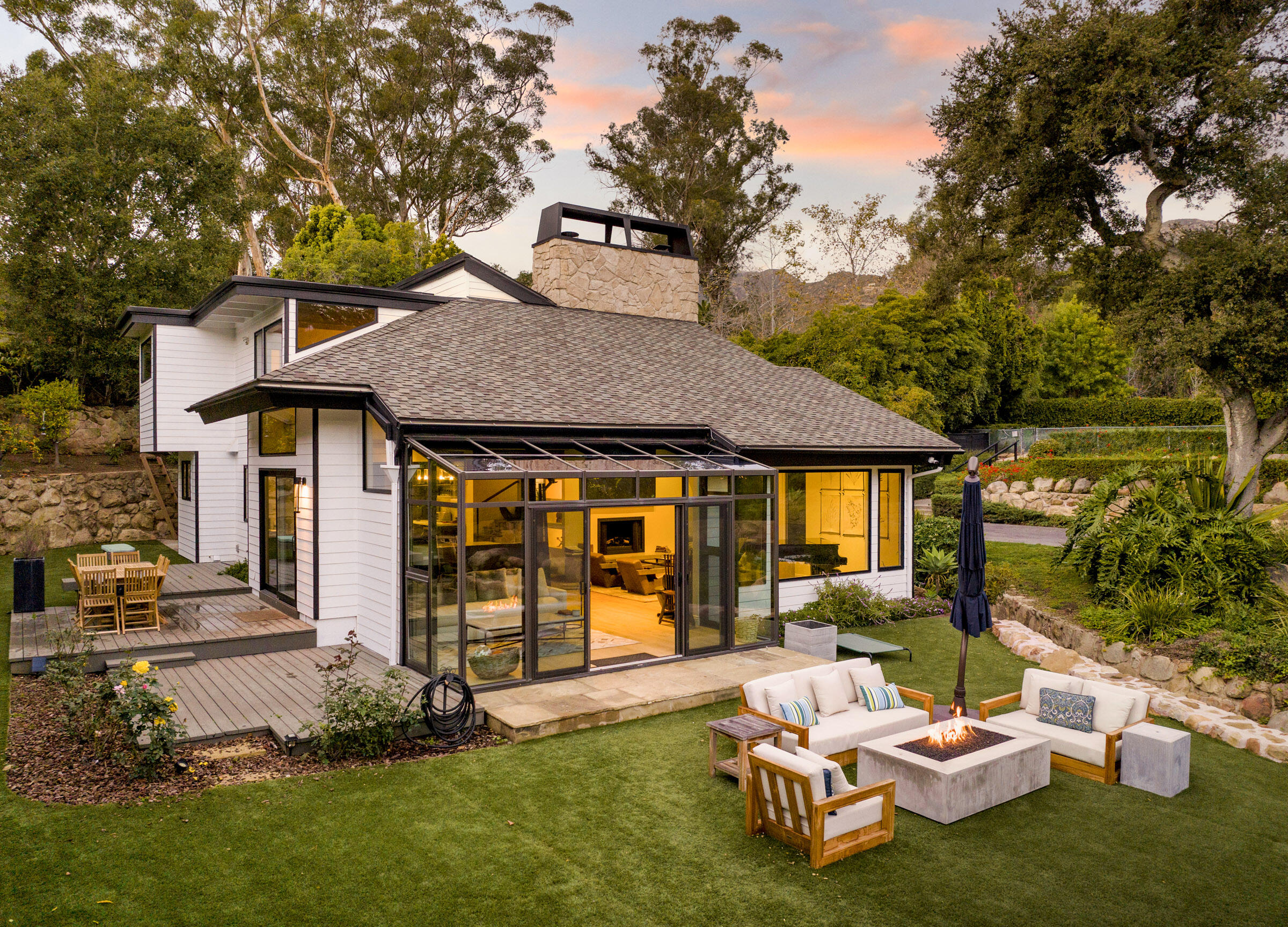790 Ayala Lane Montecito, CA 93108 - Photo 23 of 24 a view of a patio with table and chairs and potted plants with large tree