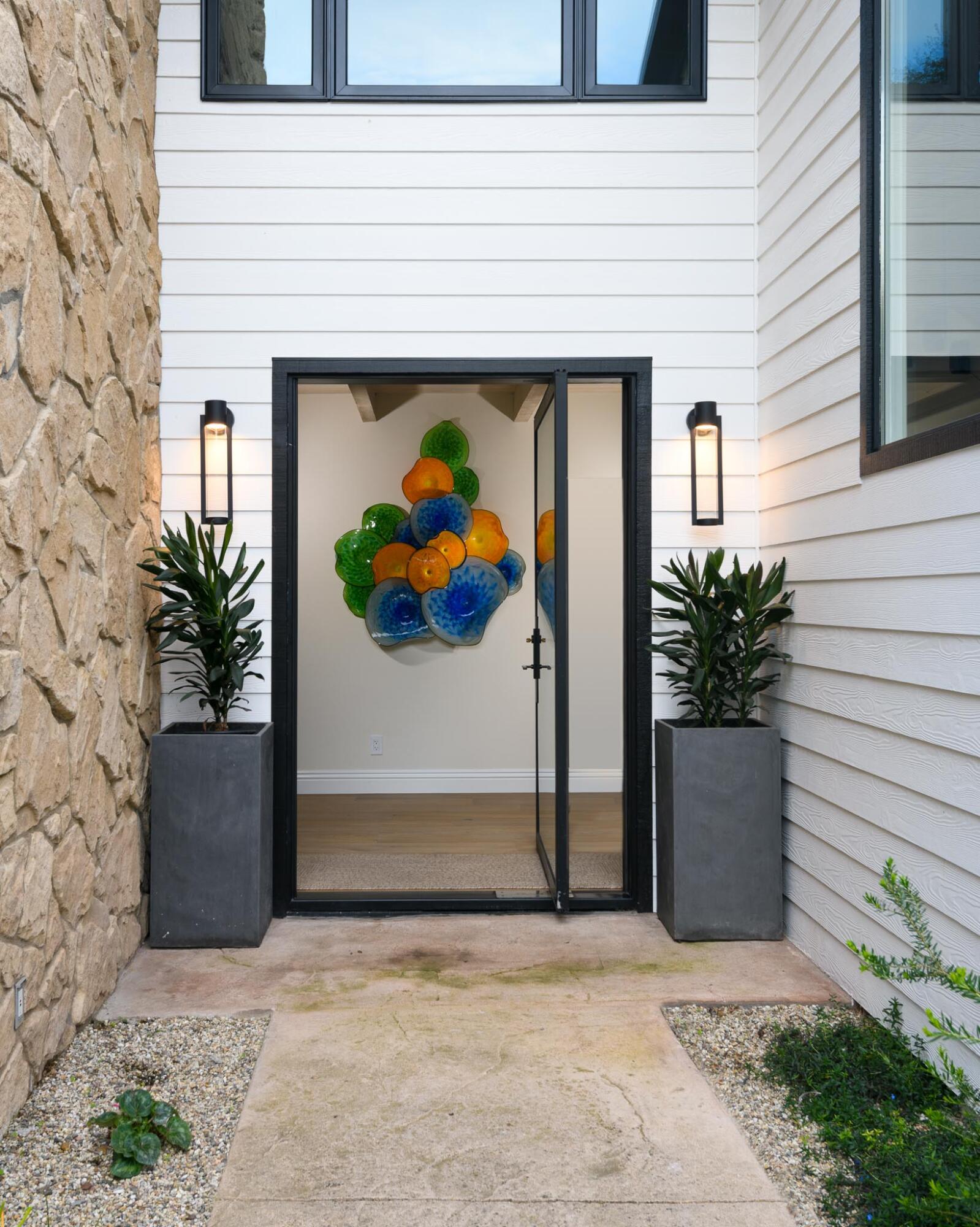 790 Ayala Lane Montecito, CA 93108 - Photo 4 of 24 a view of a door with a potted plant