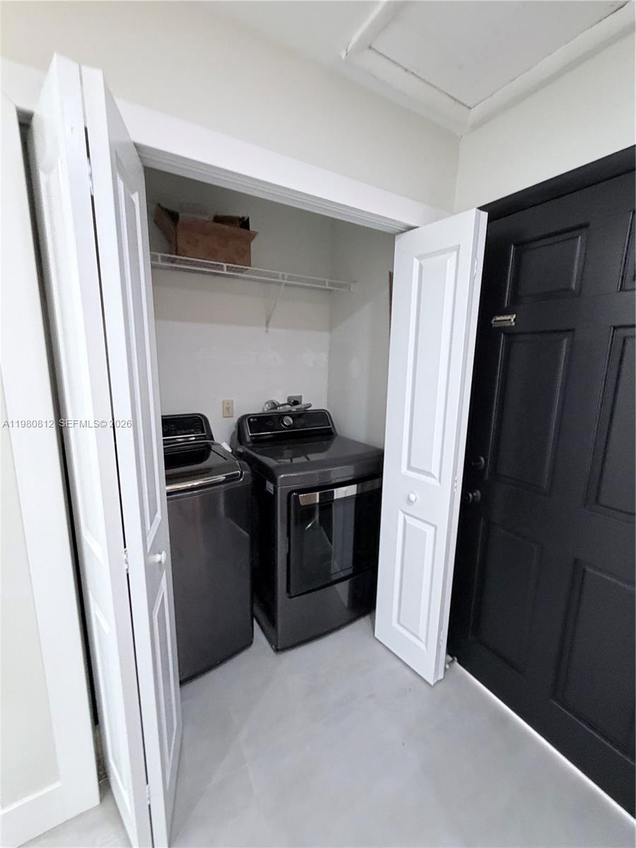 7801 Southwest 12th Street, Unit 7801 Miami, FL 33144 - Photo 12 of 12 a kitchen with stainless steel appliances a refrigerator and a sink