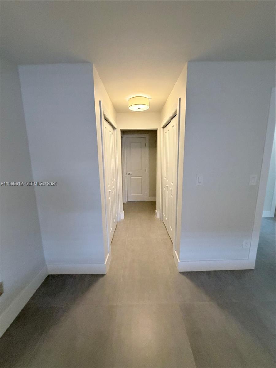 7801 Southwest 12th Street, Unit 7801 Miami, FL 33144 - Photo 6 of 12 a view of a big room with closet and cabinet