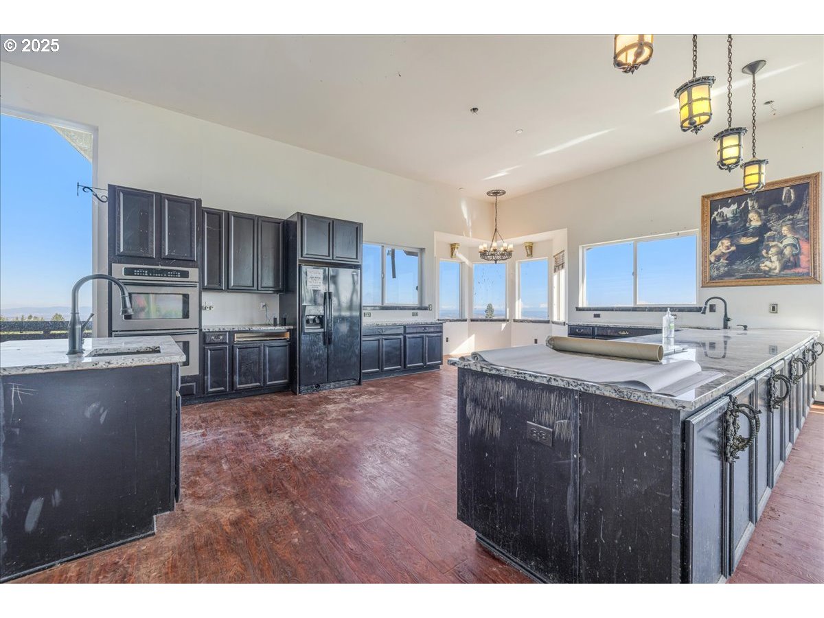 18925 Northeast Jaquith Road Newberg, OR 97132 - Photo 17 of 27 a kitchen with granite countertop a sink a counter top space appliances and cabinets