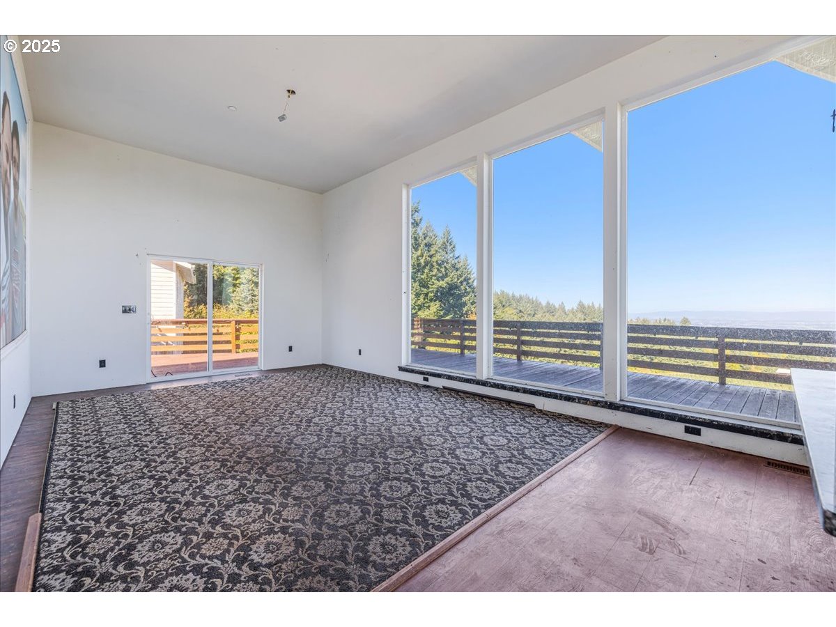 18925 Northeast Jaquith Road Newberg, OR 97132 - Photo 19 of 27 a view of empty room with wooden floor and windows