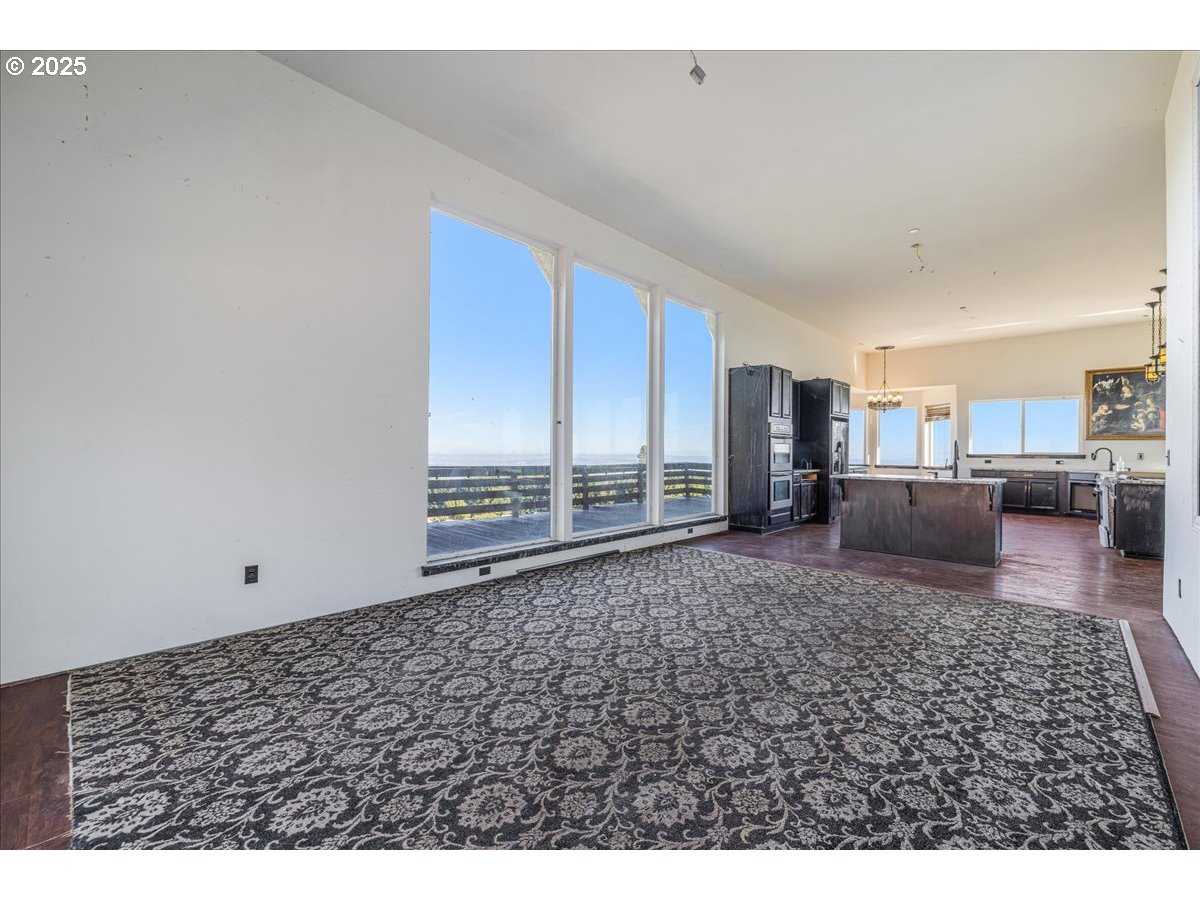 18925 Northeast Jaquith Road Newberg, OR 97132 - Photo 20 of 27 a view of a livingroom with furniture and floor to ceiling window