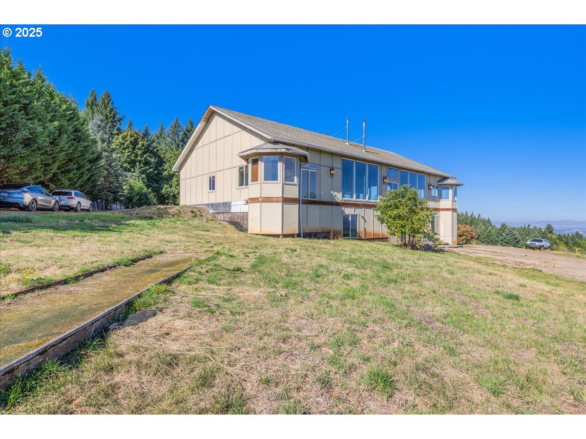 18925 Northeast Jaquith Road Newberg, OR 97132 - Photo 8 of 27 a view of a house with a yard