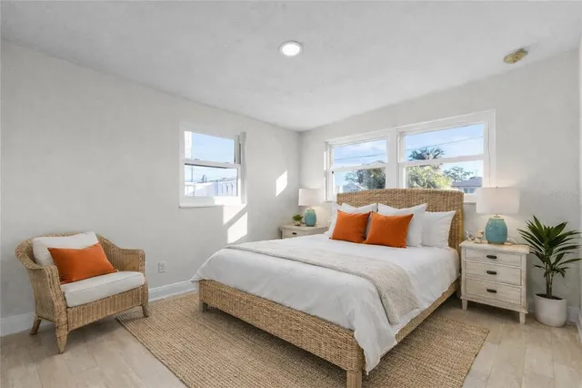 a bedroom with a bed and a couch