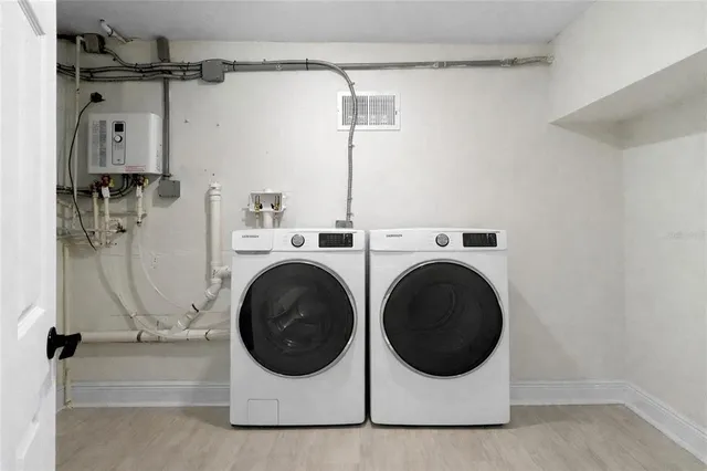 a utility room with dryer and washer