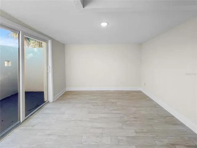 an empty room with sliding door