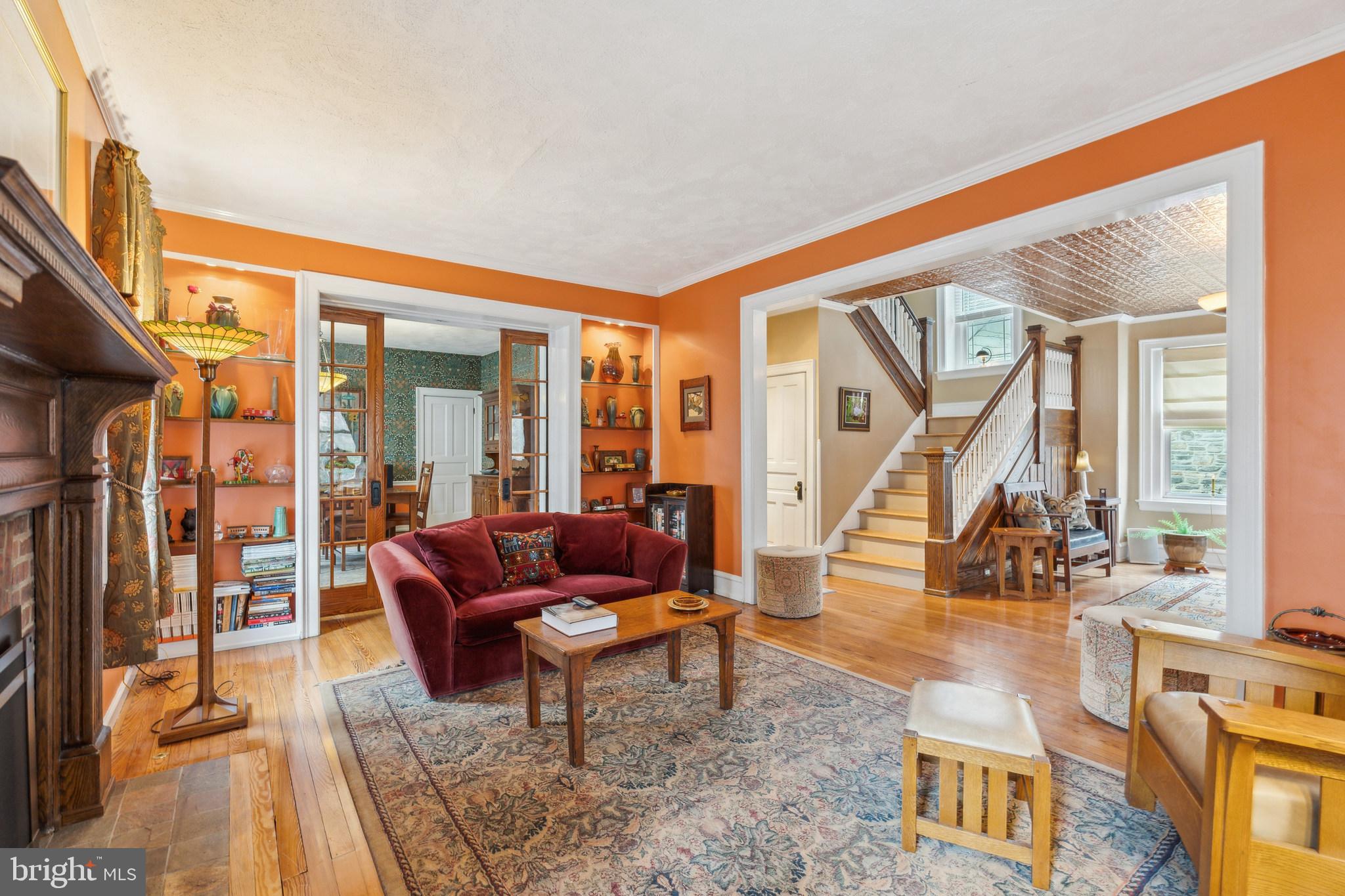 125 Township Line Road Jenkintown, PA 19046 - Photo 11 of 41 a living room with furniture and a floor to ceiling window