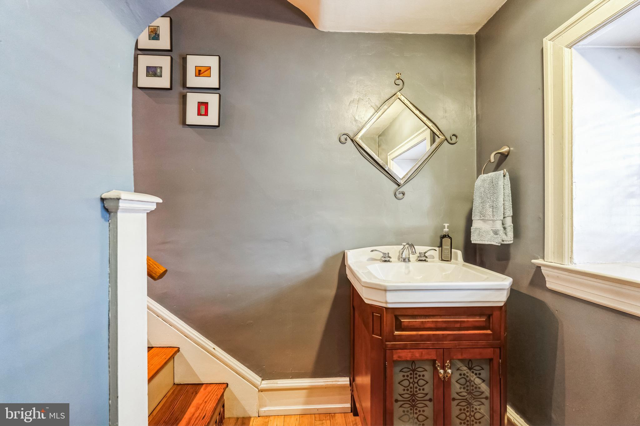 125 Township Line Road Jenkintown, PA 19046 - Photo 14 of 41 a bathroom with a sink mirror and vanity