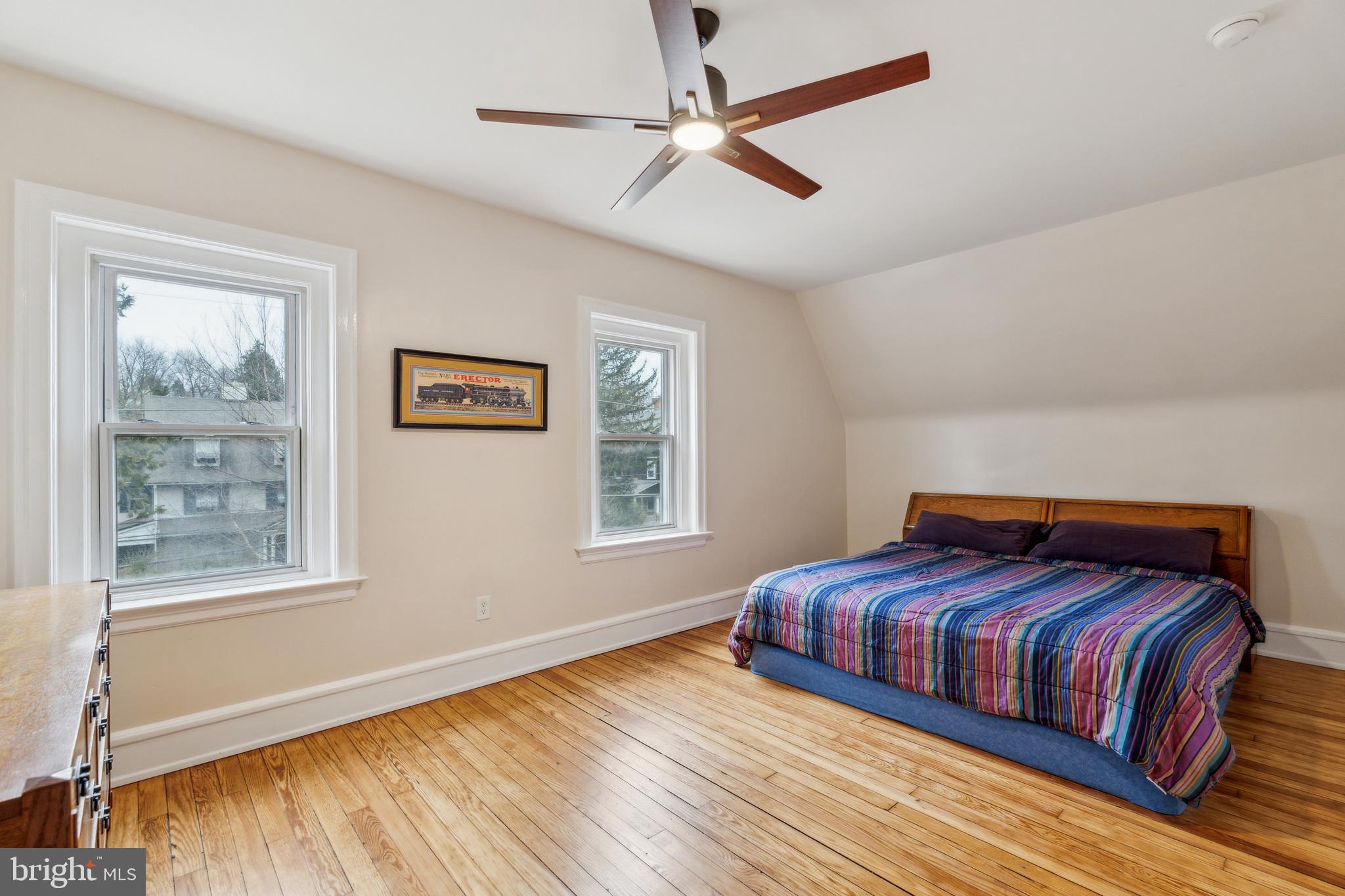 125 Township Line Road Jenkintown, PA 19046 - Photo 25 of 41 a bedroom with a bed and wooden floor