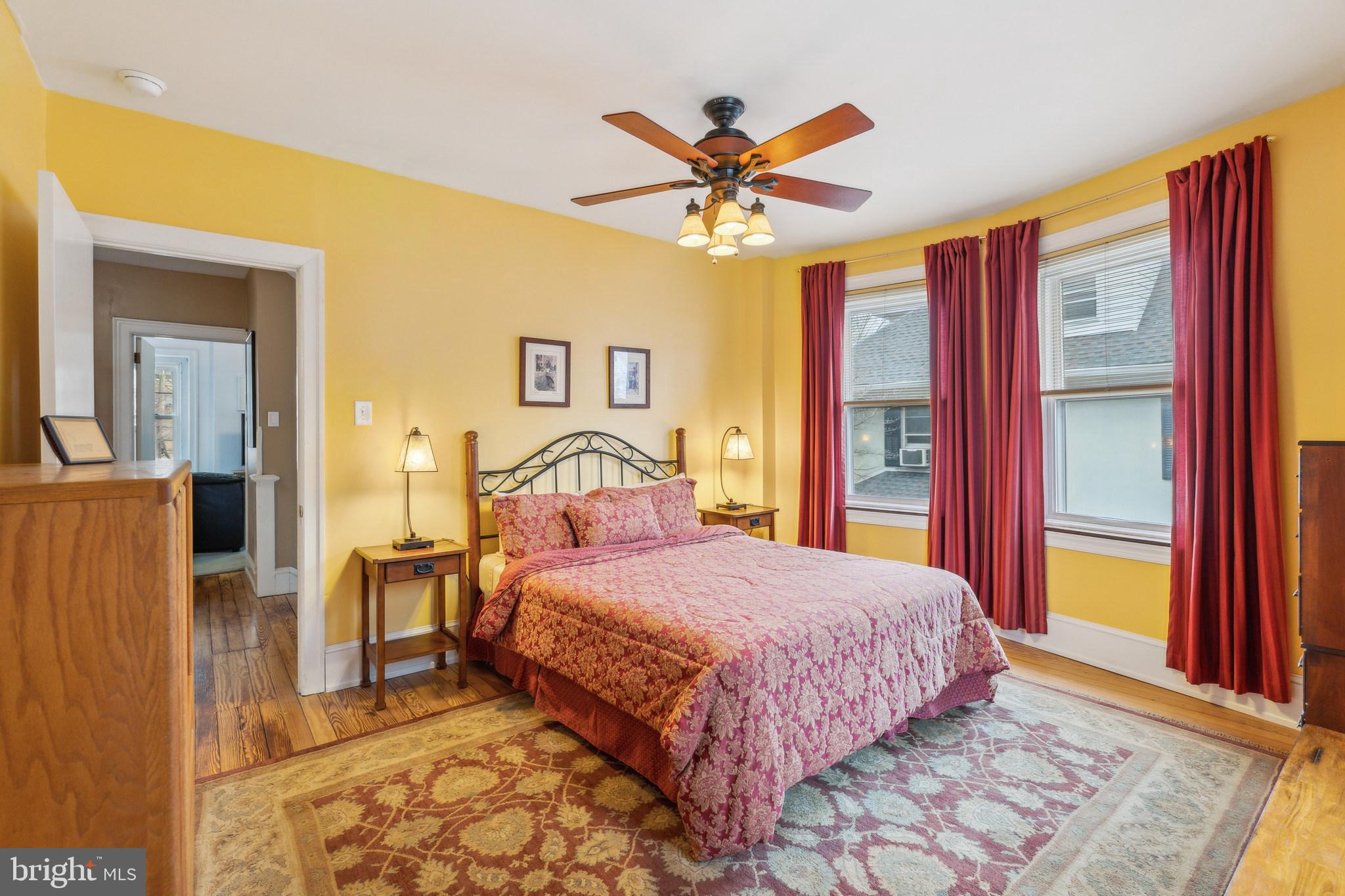 125 Township Line Road Jenkintown, PA 19046 - Photo 28 of 41 a bedroom with a bed and a chandelier