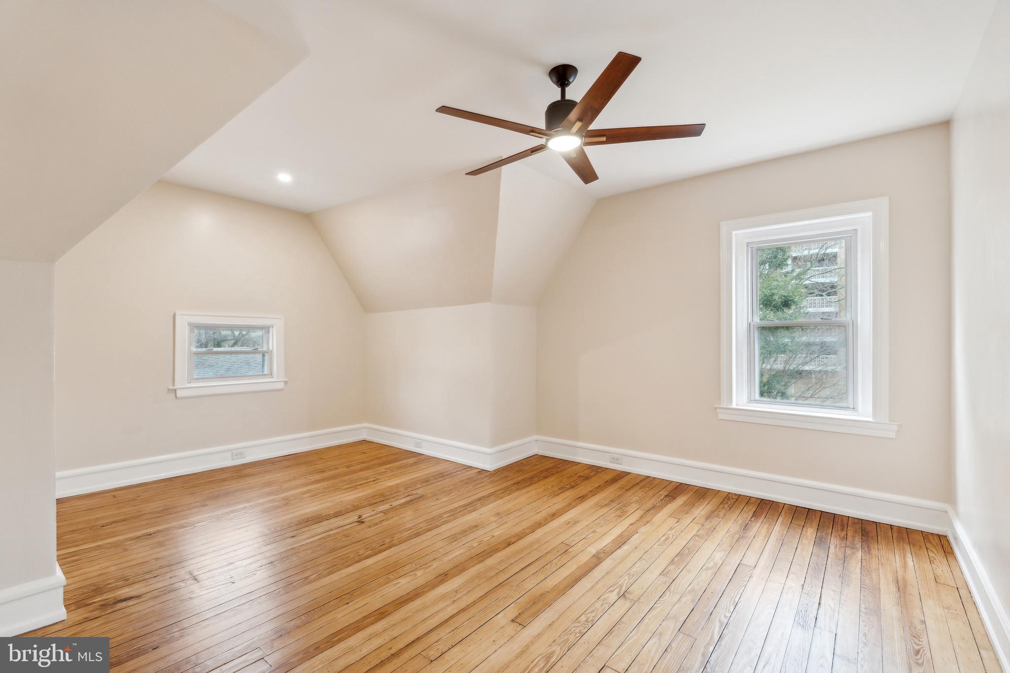 125 Township Line Road Jenkintown, PA 19046 - Photo 32 of 41 a view of empty room with wooden floor and window