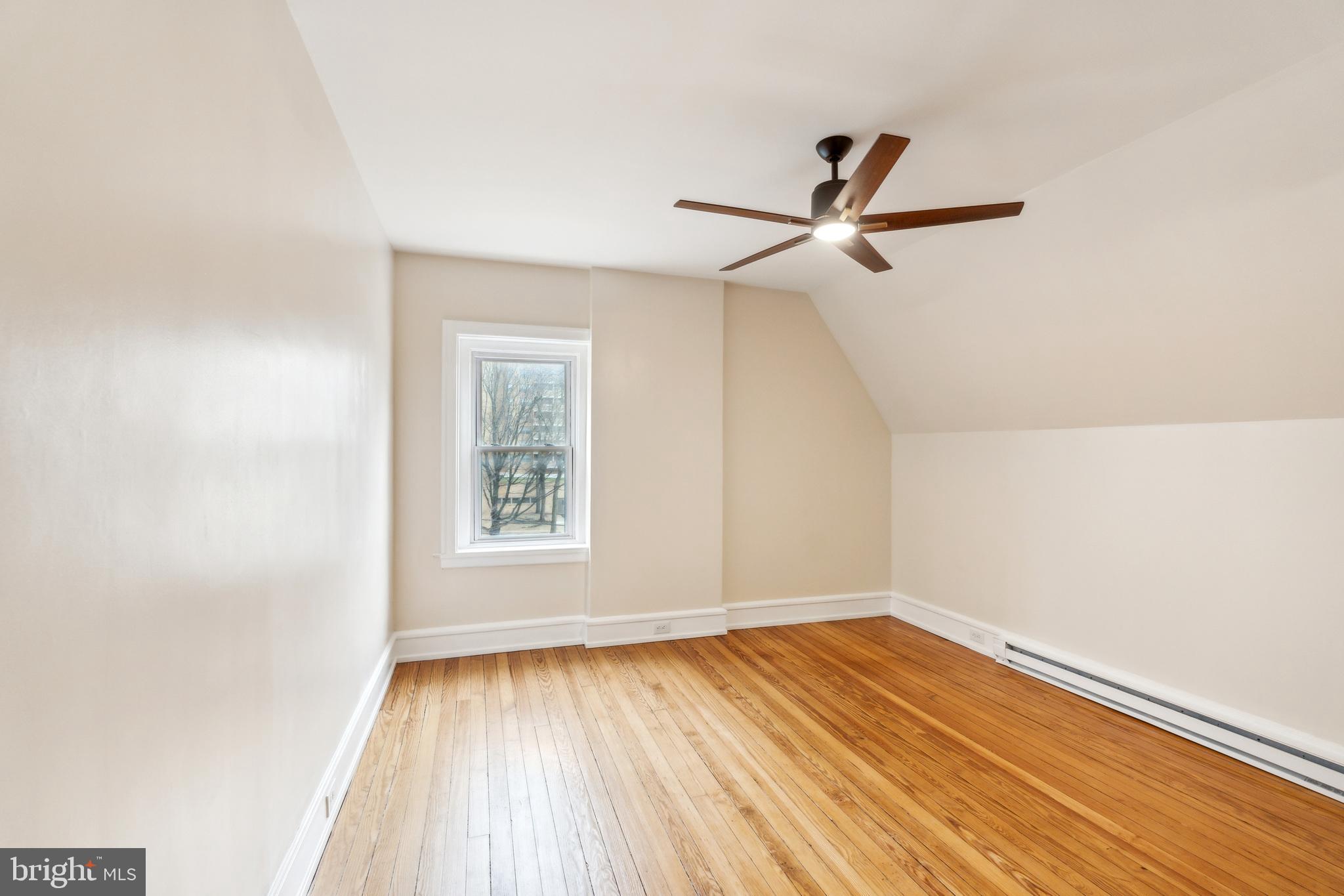 125 Township Line Road Jenkintown, PA 19046 - Photo 33 of 41 wooden floor in an empty room with a window