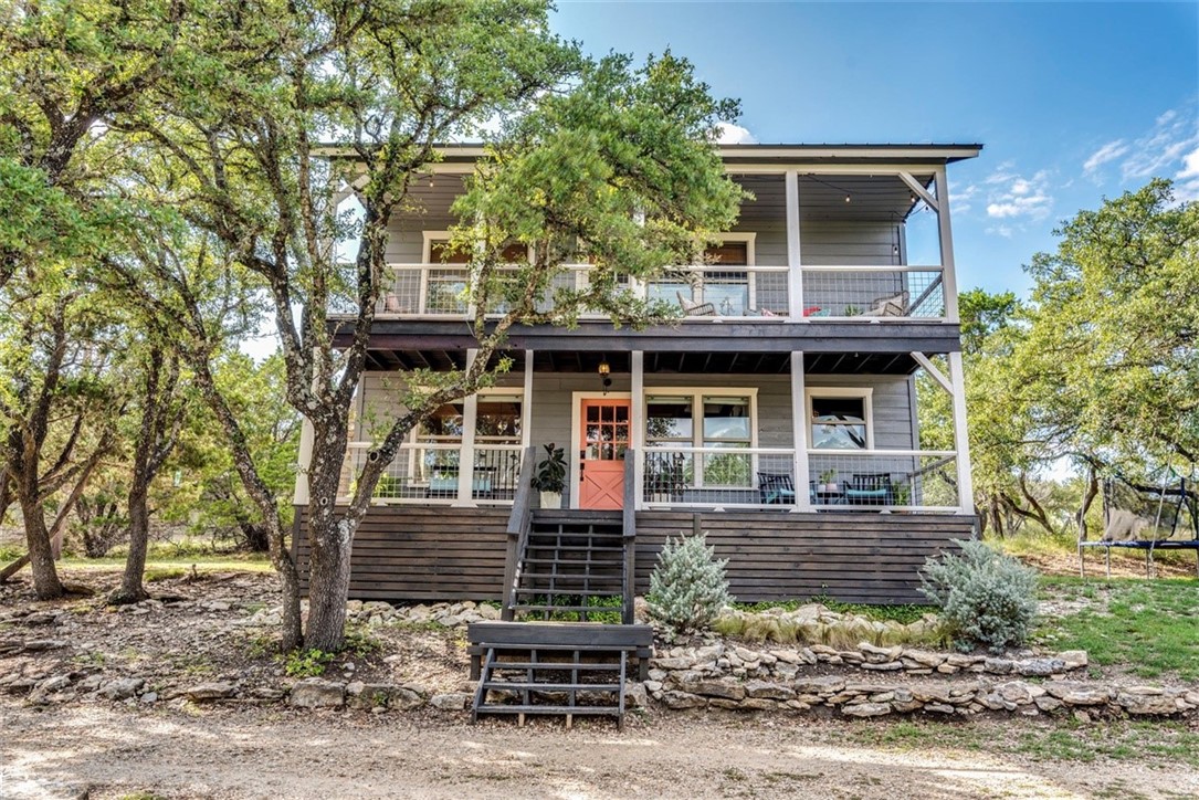 650 Springlake Drive Dripping Springs, TX 78620 - Photo 1 of 1 front view of a house with a yard