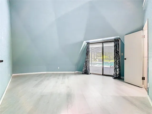 a bathroom with a granite countertop sink a mirror and a shower
