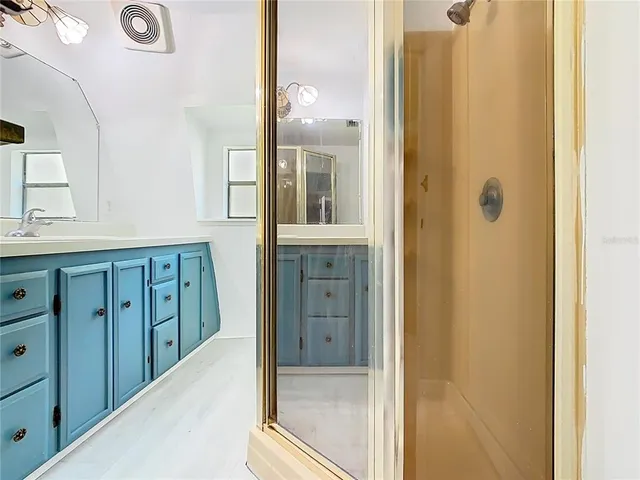 a white toilet sitting next to a bathroom sink