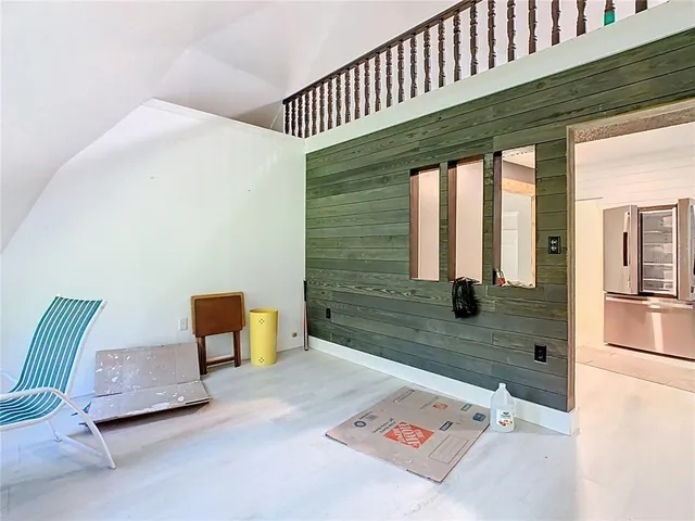 a kitchen with granite countertop white cabinets and stainless steel appliances