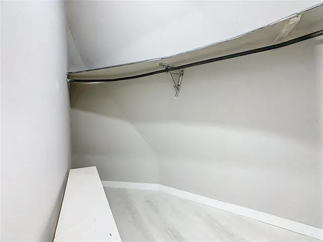 a view of a hallway with closet