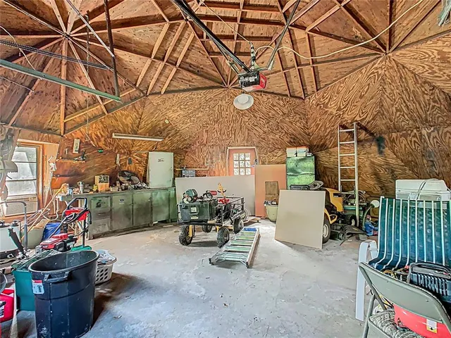 an empty room with floor to ceiling windows and pool table