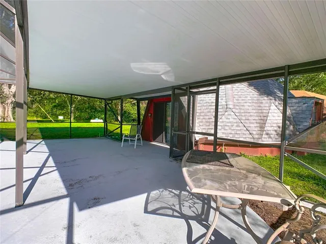 a view of backyard with swimming pool