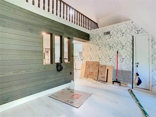 a kitchen with cabinets and stainless steel appliances