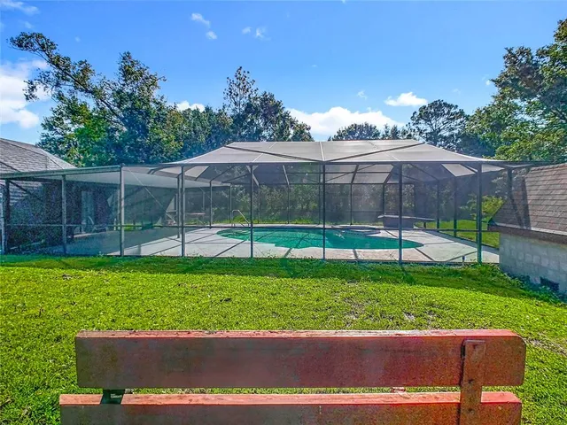 an aerial view of a swimming pool and outdoor space