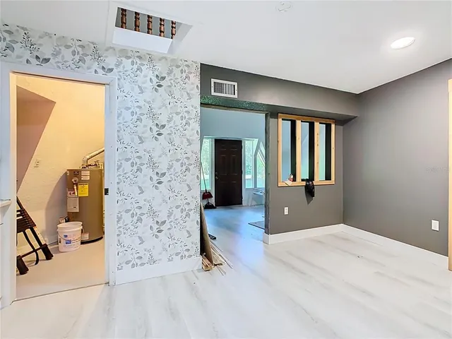 a view of a room with a trees in front of it