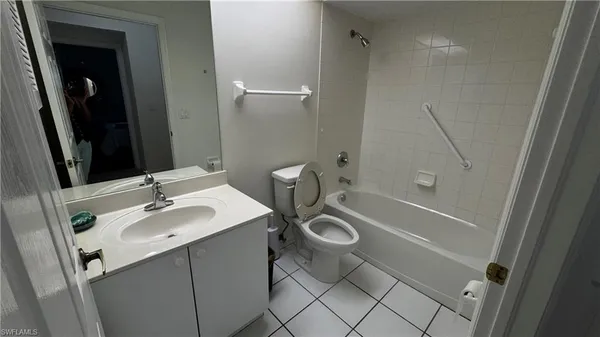 a bathroom with a sink a mirror and a shower