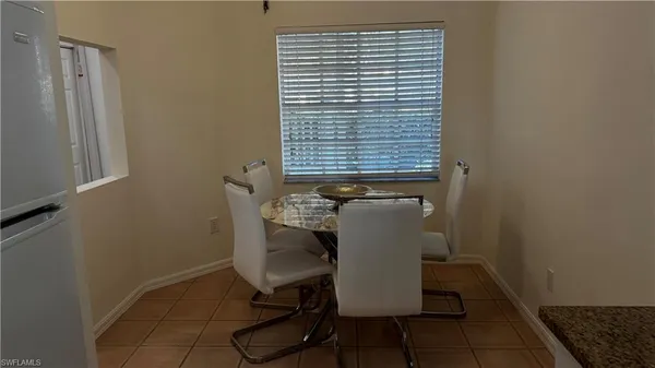 a view of a door and chair in a room