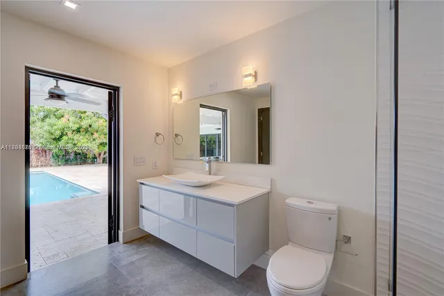 a bathroom with a shower and a glass door