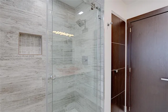 a bathroom with a sink toilet and mirror