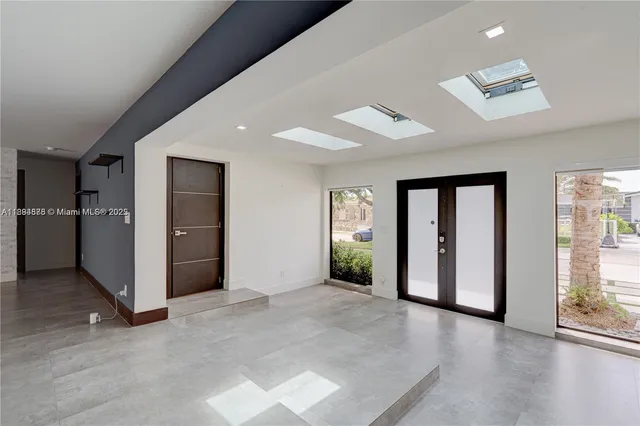 a view of a house with garden and trees