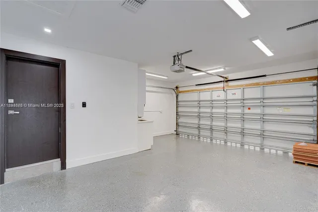 a view of a house with pool and sitting area