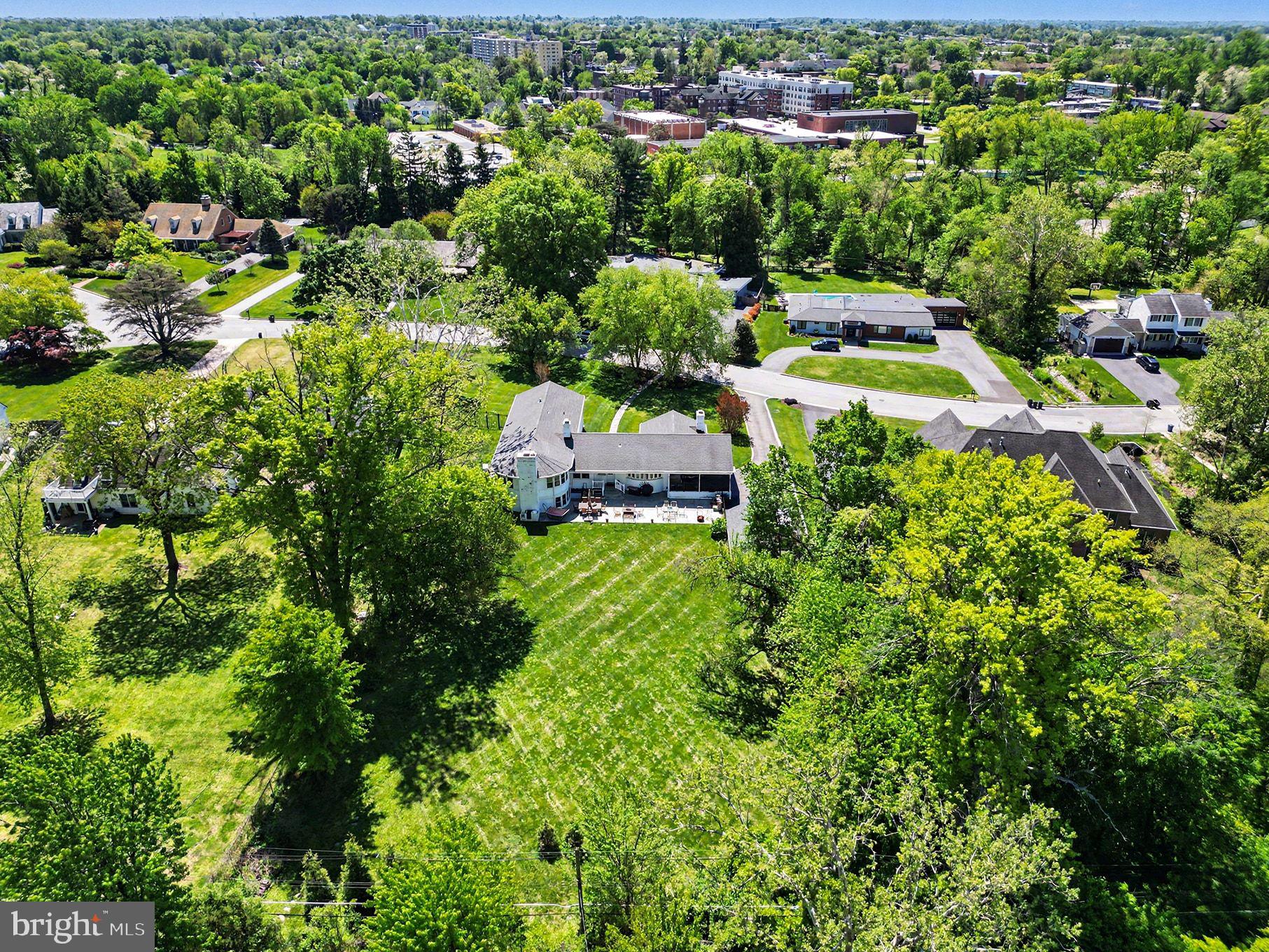 3522 Barton Oaks Road Baltimore, MD 21208 - Photo 9 of 86 an aerial view of residential houses with outdoor space and trees