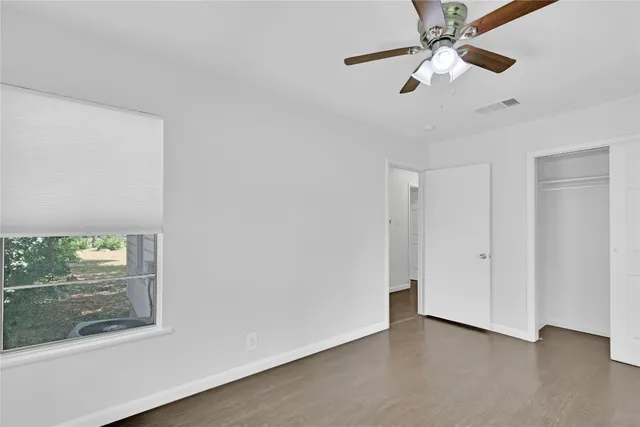 an empty room with fan