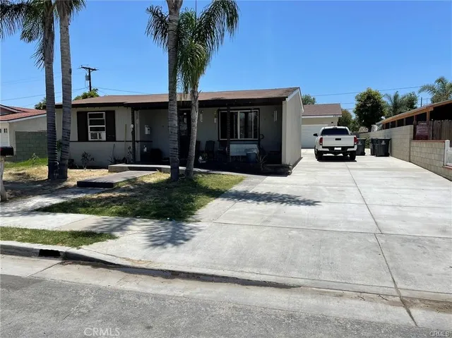 a house with palm tree in front of it