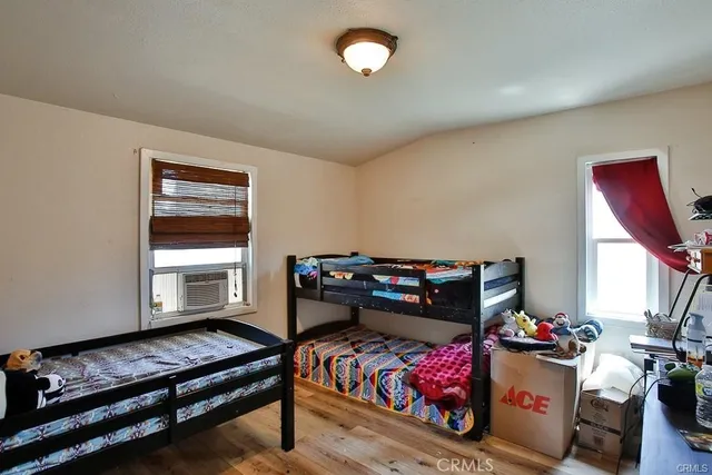 a bedroom with furniture and a window