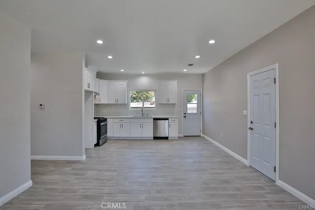a view of kitchen with wooden floor